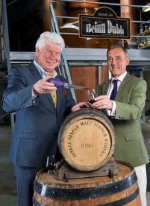 Speyside Distillery CEO John Harvey McDonough (left) joins Spirit of Speyside Whisky Festival chairman James Campbell (centre) in sampling the cask
